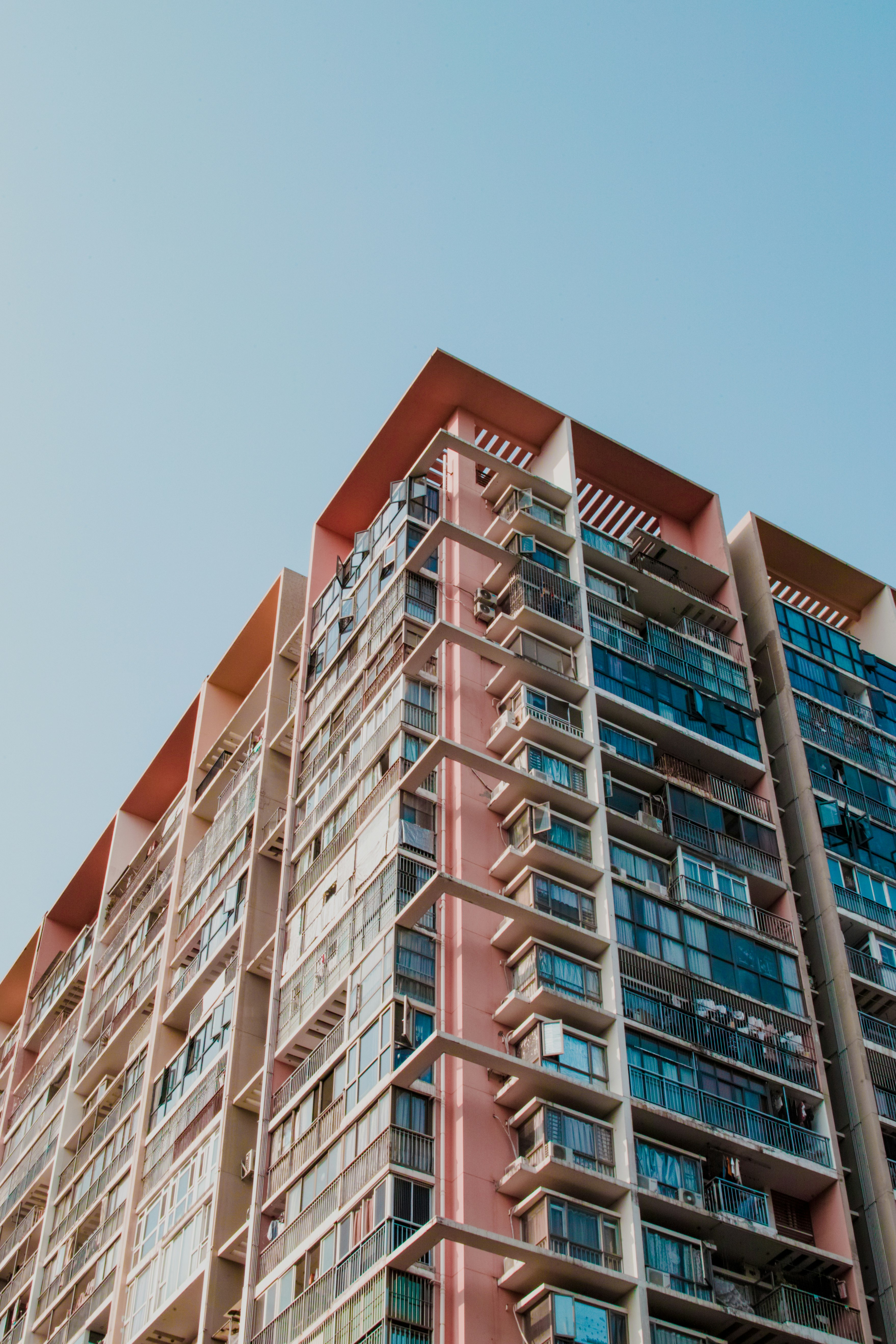 brown and white concrete building under blue sky during daytime